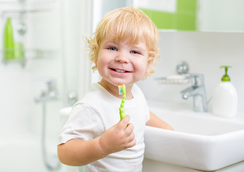 What kind of toothbrush and toothpaste should my child use?